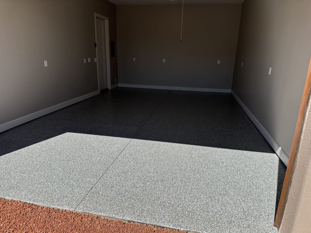 Gray epoxy flake garage floor coating with a seamless, durable, UV-resistant finish for residential garages and commercial spaces.
